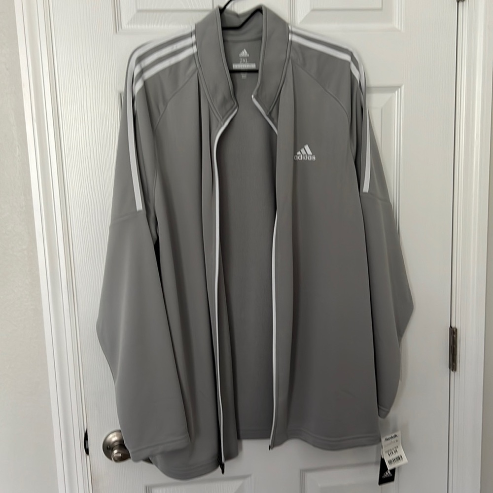 Adidas performance jacket for golf or other activities. 2xl. Never been worn.